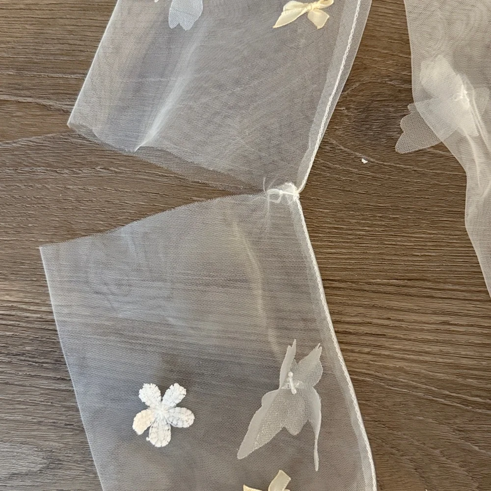 New Opera length tulle butterfly and bow embellished globes
